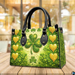 Angled green clover handbag with gold hearts and glitter-like highlights
