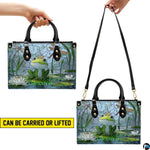 Top-down view displaying interior compartment and black carrying handles of the handbag.