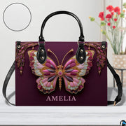 Top down view of plum butterfly handbag displaying spacious interior opening