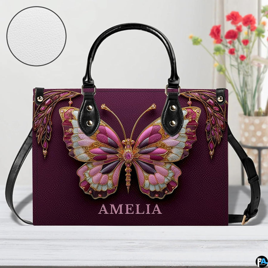 Top down view of plum butterfly handbag displaying spacious interior opening