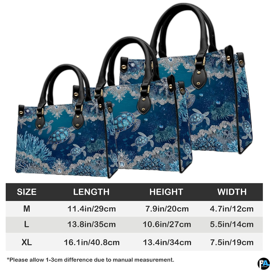 Coordinated arrangement of sea turtle handbag and wallet highlighting the unified marine artwork.