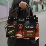 Outdoor pedestrian holding an accessory showcasing hymn art prints during a daytime stroll.