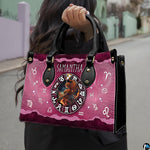 Outdoor street showcase of Celestial Archer Satchel Handbag carried on city walkway.