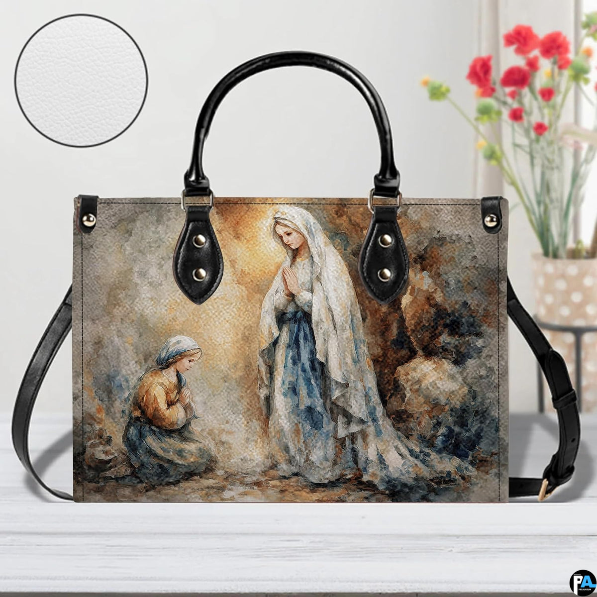 Model walking outdoors carrying Our Lady of Lourdes devotional handbag.