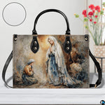 Model walking outdoors carrying Our Lady of Lourdes devotional handbag.
