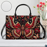 Matching crimson jeweled butterfly wallet detailing red butterfly and ruby blossoms