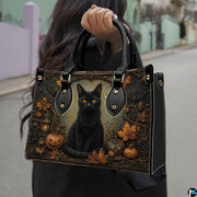 Outdoor presentation showing Halloween cat artwork held during an urban walk.