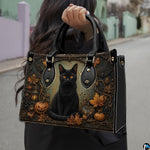 Outdoor presentation showing Halloween cat artwork held during an urban walk.