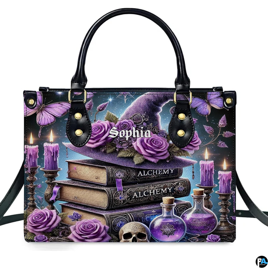 Studio frontal perspective of structured purple witch hat handbag on white background.
