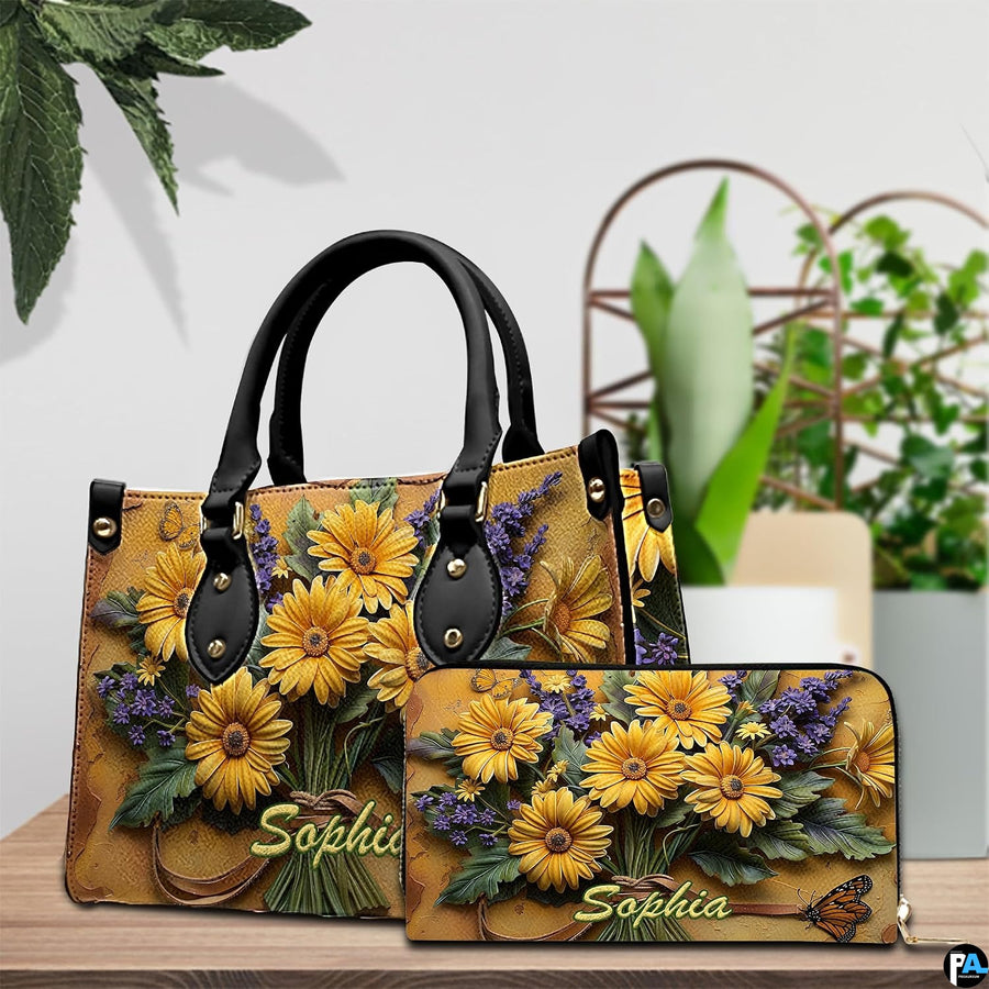 Close-up front view of handbag showing yellow daisies and lavender