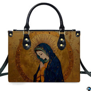 Direct front studio shot of gilded Renaissance Virgin Mary handbag on white backdrop.