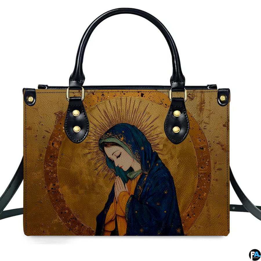 Direct front studio shot of gilded Renaissance Virgin Mary handbag on white backdrop.