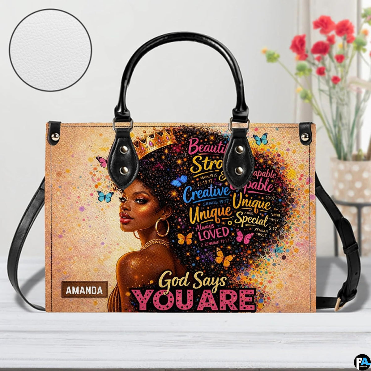 Front view of crowned afro portrait handbag with long shoulder strap