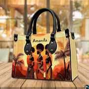 African women silhouette art shown resting upright on a polished wooden tabletop.