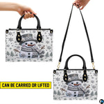 Matching elongated accessory decorated with sparkling crystal snowman and silver winter graphics.