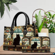 Library cat stained glass art resting beside lush potted greenery on a wooden surface.