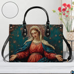 Tabletop display of the Madonna devotional handbag alongside matching wallet accessory