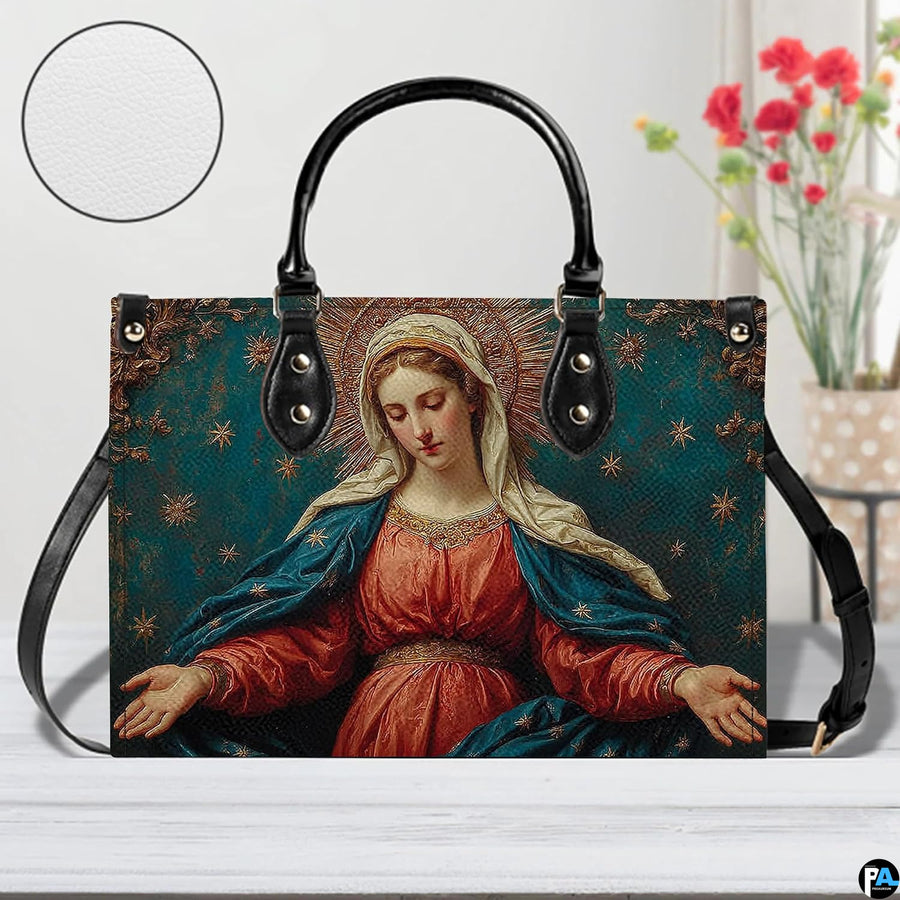 Tabletop display of the Madonna devotional handbag alongside matching wallet accessory