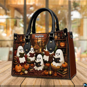 Ghost book club satchel placed on wooden table with warm ambient cafe bokeh background.