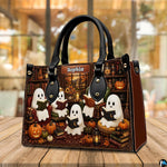 Ghost book club satchel placed on wooden table with warm ambient cafe bokeh background.