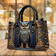 Side profile of baroque owl handbag showing continuous gilded acanthus scroll pattern along gusset