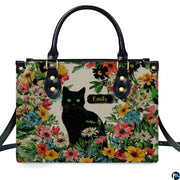 Detailed view of matching black cat wildflower zippered wallet