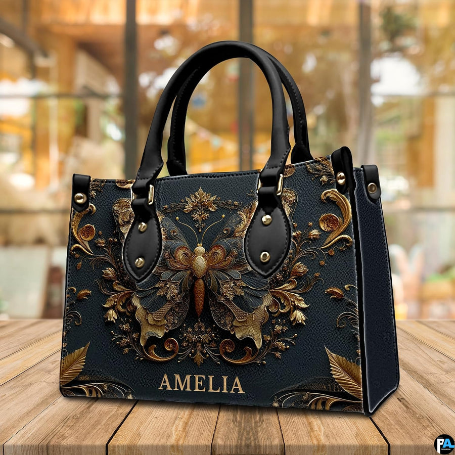 Tabletop cafe view of antique gold butterfly handbag standing on wooden surface