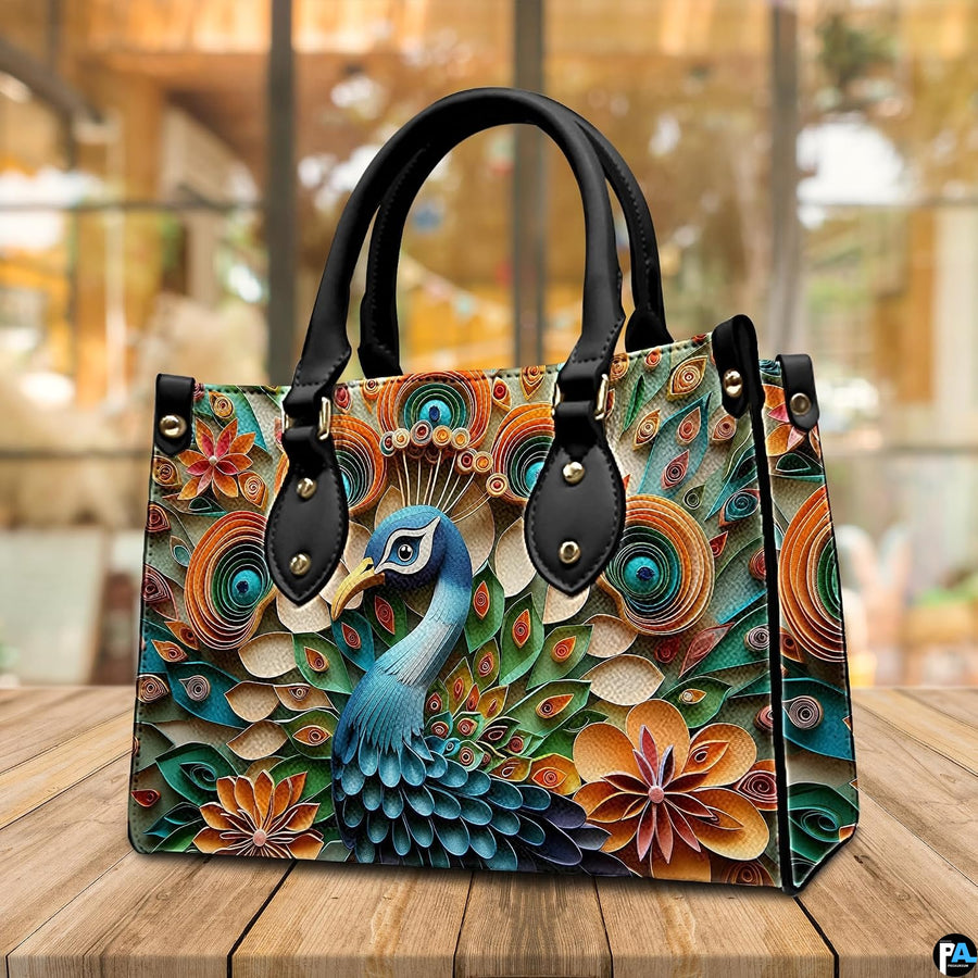 Front view of a blue peacock handbag with layered botanical artwork