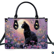 Front studio view showing black cat, butterflies, fireflies, and wildflowers under a glowing twilight moon.