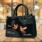 Tabletop perspective of hummingbird handbag standing upright on wooden surface