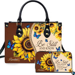 Front view of rustic sunflower and blue butterfly handbag and matching wallet with dual-tone brown and cream design.