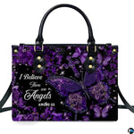 Angled perspective view of purple butterfly cross handbag highlighting sparkling botanical details.