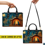 Side perspective view of Bethlehem nativity handbag and wallet showing structured profile