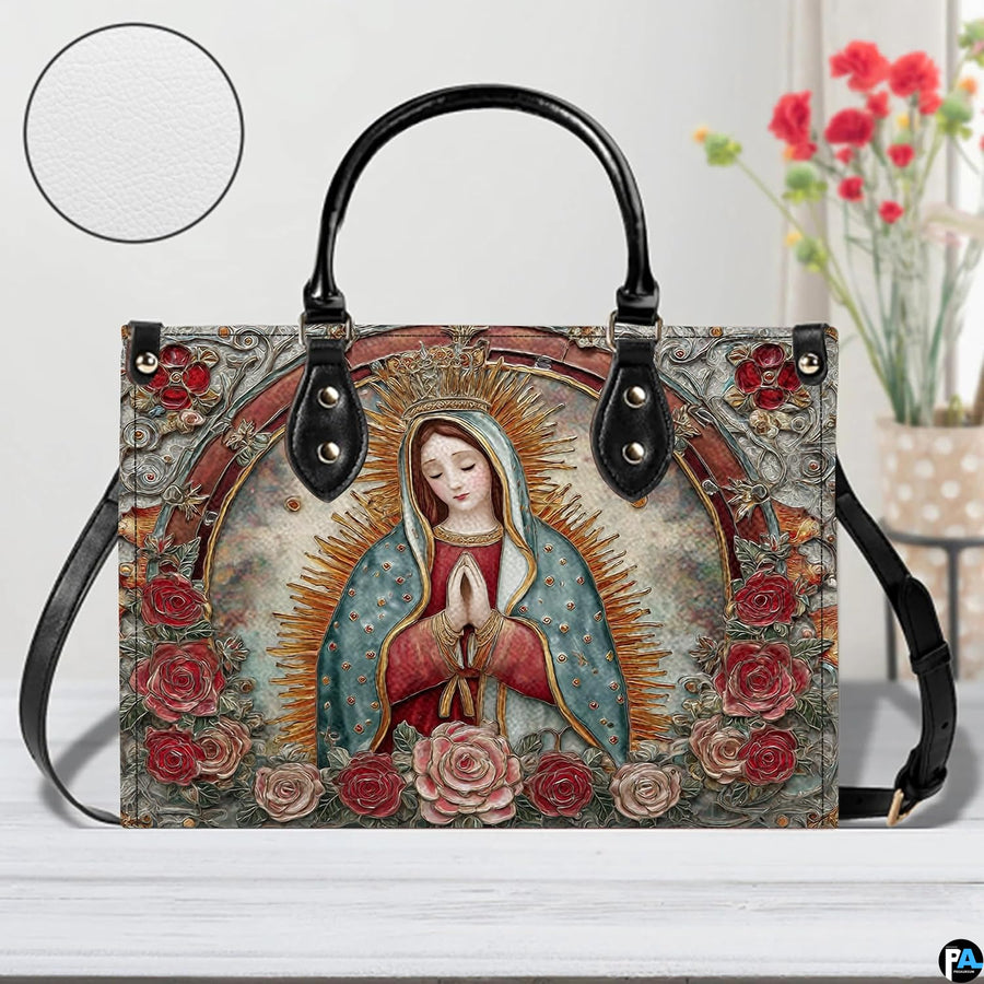 Handbag displayed outdoors in daylight showing textured fresco and rose details.