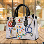 Angled view displaying the medical nursing equipment artwork printed across the handbag.