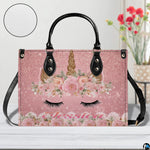Interior compartment view of unicorn handbag showing inner lining and organization.