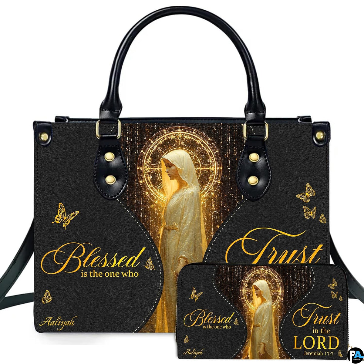Front view of black and gold handbag with matching wallet featuring glowing sacred halo and butterfly artwork.