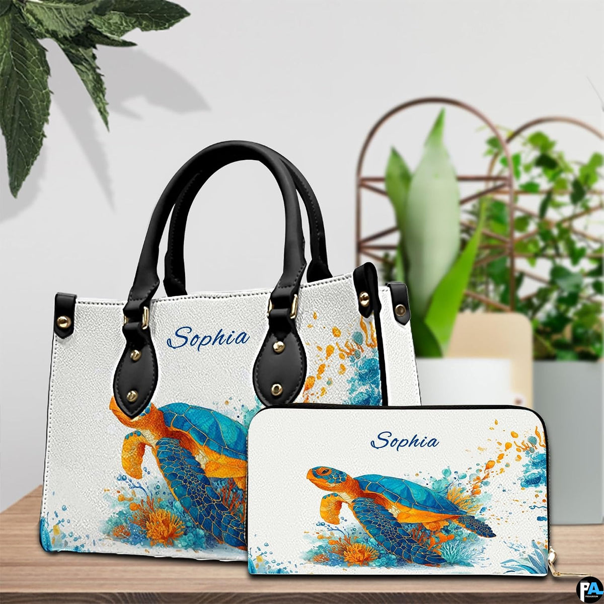 Lifestyle model display showing the splatter turtle handbag carried over the shoulder.