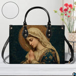 Devotional mosaic handbag displayed indoors beside a decorative flower vase