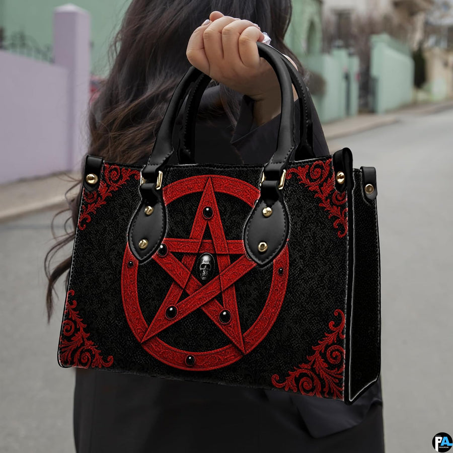 Gothic pentagram handbag held by top handle while walking outdoors along a residential street.