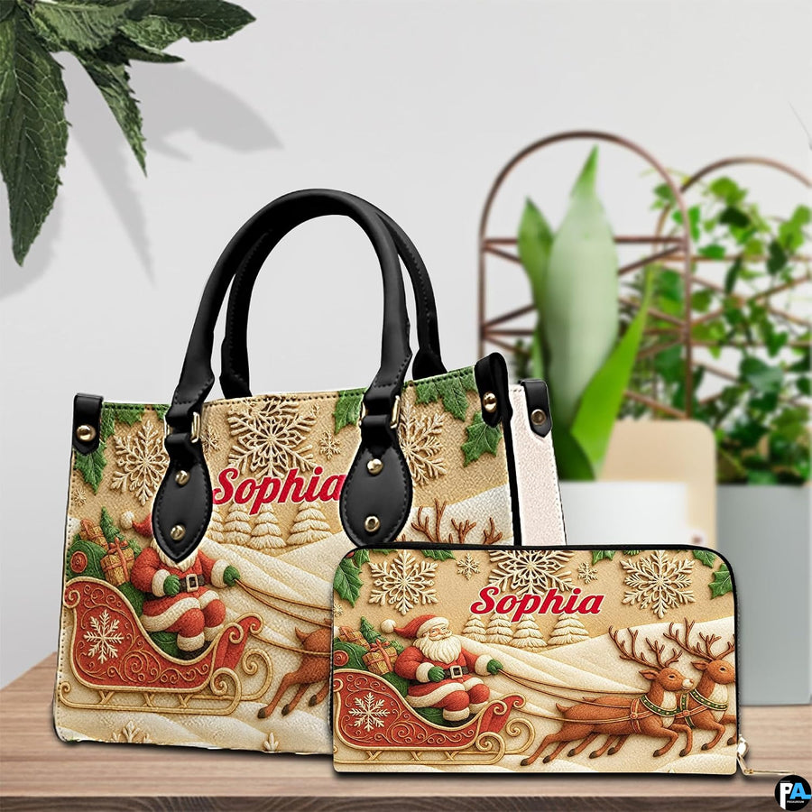 Matching carved Santa sleigh handbag and zip wallet set displayed on wooden tabletop