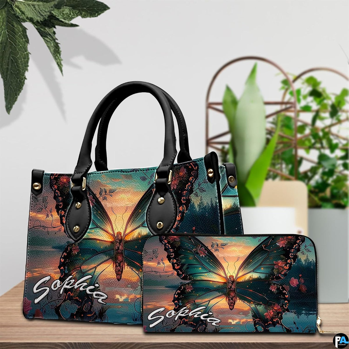 Front close-up view of handbag showing sunset butterfly scenery