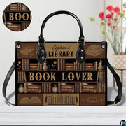 Library bookshelf handbag on plain background with circular inset material texture detail swatch.