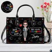 Handbag interior compartment arranged for daily personal and teaching essentials.