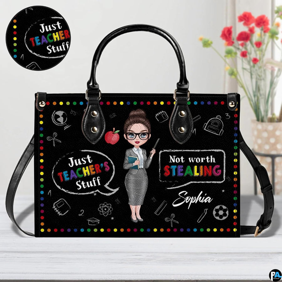 Handbag interior compartment arranged for daily personal and teaching essentials.
