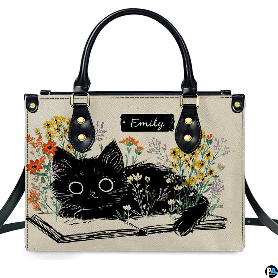 Detailed view of matching literary black kitten zippered wallet