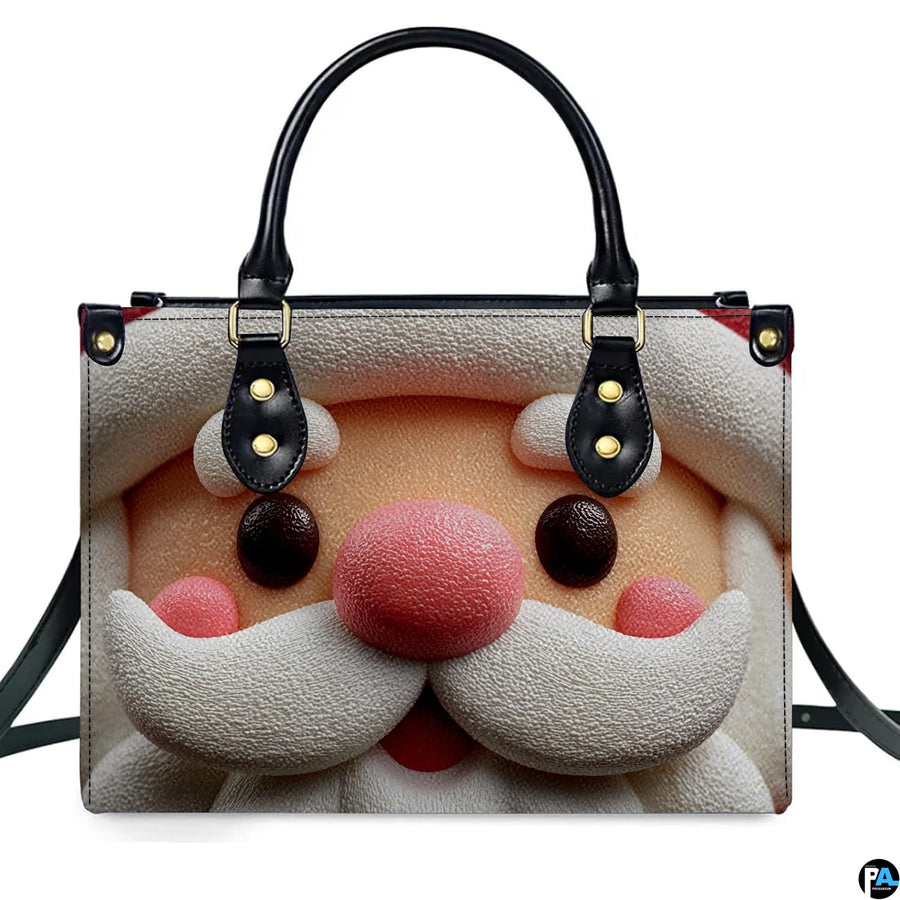 Front studio shot of structured holiday handbag featuring cute sculpted clay Santa Claus face artwork