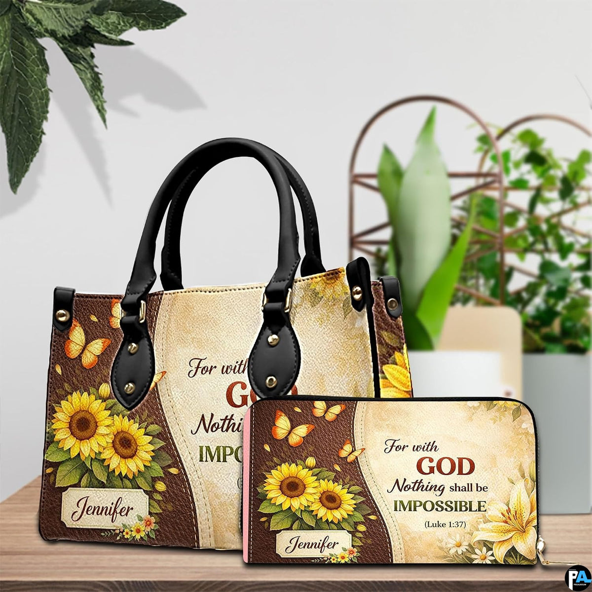 Sunflower and lily botanical design ensemble on light wooden surface beside potted foliage.