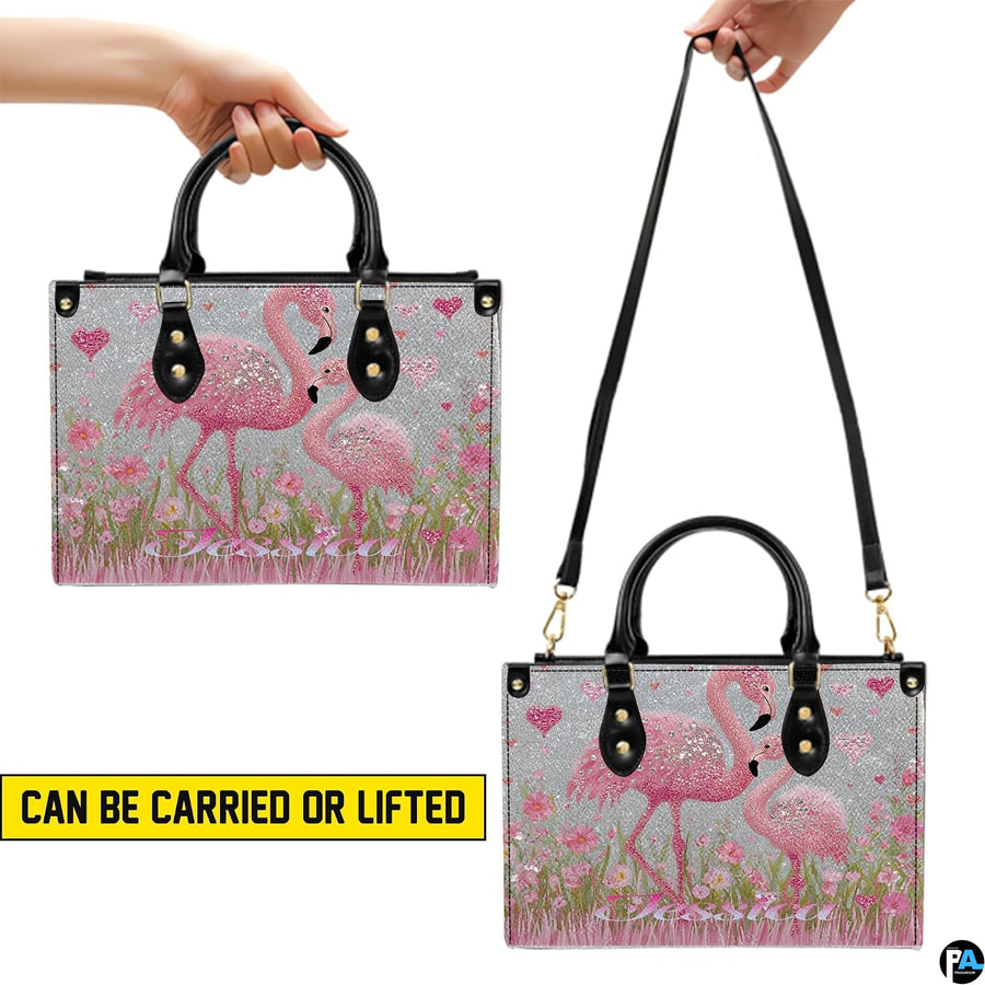 Matching pink flamingo wallet displayed flat showing exterior mother and chick artwork.