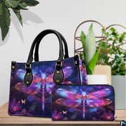 Side view of neon dragonfly handbag showing continuous celestial glowing artwork on side panel